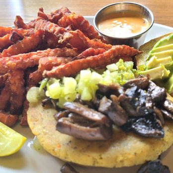Black Sheep Social Club - Vegan Falafel Burger with added mushrooms & avocado, sweet potato fries - Lounges Near Me - Cedar Rapids, Iowa Black Sheep Social Club - Vegan Falafel Burger with added mushrooms & avocado, sweet potato fries - Lounges Near Me - Cedar Rapids, Iowa