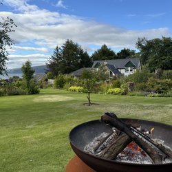 Pennygate Lodge - Firepit looking over the front lawn