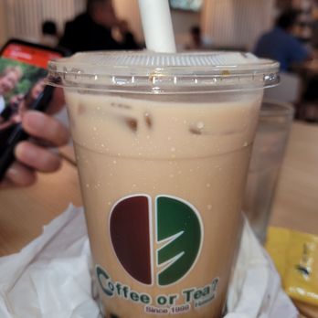 Coffee or Tea? - a person taking a picture of a drink - Bubble Tea Near Me - Aiea, Hawaii