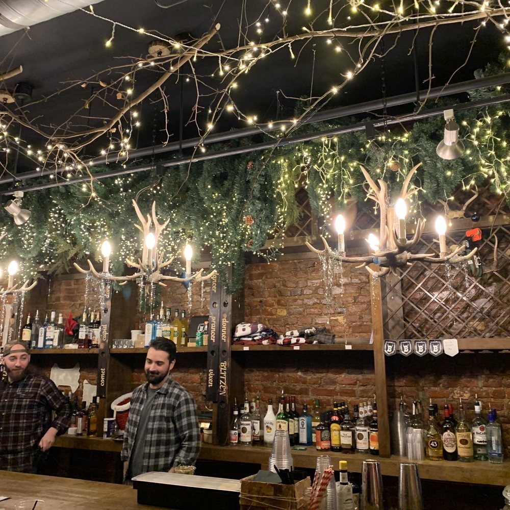 Blitzen - people at a bar with lights hanging from the ceiling - Bars Near Me - Wilmington, Delaware