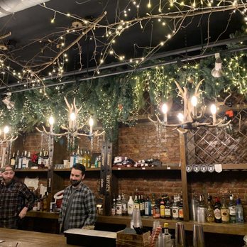 Blitzen - people at a bar with lights hanging from the ceiling - Bars Near Me - Wilmington, Delaware