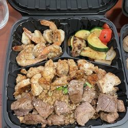 Three of a Kind: Chicken, Shrimp and Filet Mignon with fried rice and veggies.