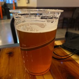 a glass of beer on a table