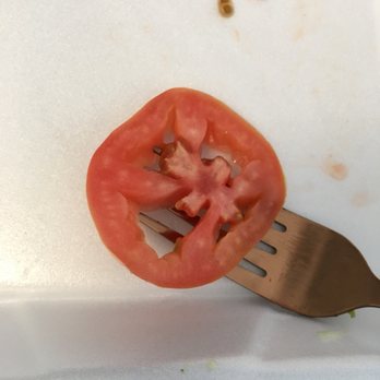 El Caporal - a tomato cut in half on a fork - Mexican Near Me - Altadena, California