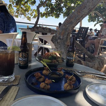 Restaurante Mezzanine - Indio beer with a vaso michelado, crispy money bags (wontons filled with shrimp and ginger) - Thai Near Me - Tulum, ROO Restaurante Mezzanine - Indio beer with a vaso michelado, crispy money bags (wontons filled with shrimp and ginger) - Thai Near Me - Tulum, ROO