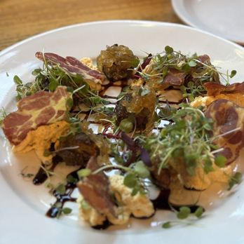 Brussels Bistro - Brussels sprouts- pork coppa chips, mustard espuma, onions confit, micro mix, and balsamic glaze - Belgian Near Me - Laguna Beach, California