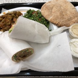 A Gyro Wrap and two sides: smothered okra and tabouli salad A Gyro Wrap and two sides: smothered okra and tabouli salad