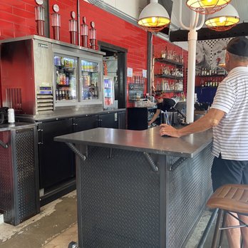 Eagle's Dare - a man standing at a bar - Bars Near Me - Wilmington, North Carolina Eagle's Dare - a man standing at a bar - Bars Near Me - Wilmington, North Carolina