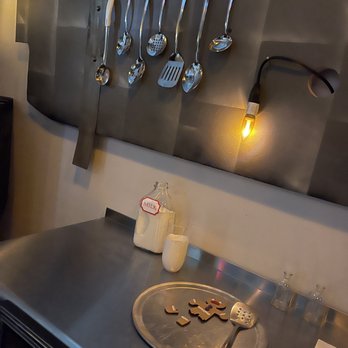 Vignettes - a kitchen counter with utensils hanging on the wall - Cocktail Bars Near Me - North Kansas City, Missouri Vignettes - a kitchen counter with utensils hanging on the wall - Cocktail Bars Near Me - North Kansas City, Missouri