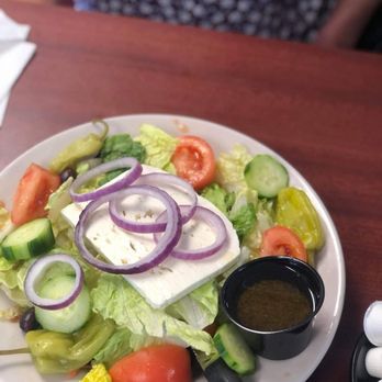 Southeast Eatery - a plate of salad with dressing - American Near Me - Winter Haven, Florida