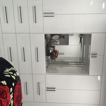 Fine Kitchen Work - white cabinets with red roses - General Contractors Near Me