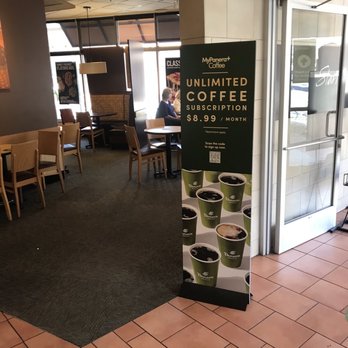 Panera Bread - A promotional sign for Panera Bread's unlimited coffee subscription at Leesburg, VA, priced at $8.99 per month, with images of coffee cups. - Sandwiches Near Me - Leesburg, Virginia