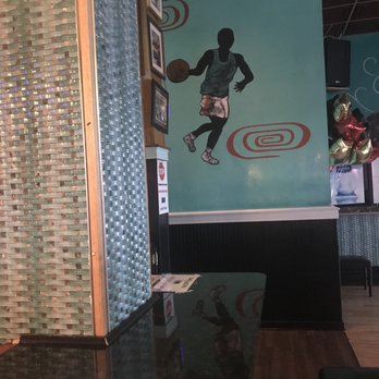 Game Room & Grill - a basketball player on the wall - American Near Me - Fort Washington, Maryland