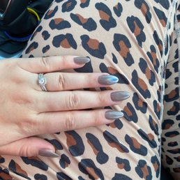 Dip powder nails in color "sand storm" with an iridescent ombré effect for accent. Dip powder nails in color "sand storm" with an iridescent ombré effect for accent.