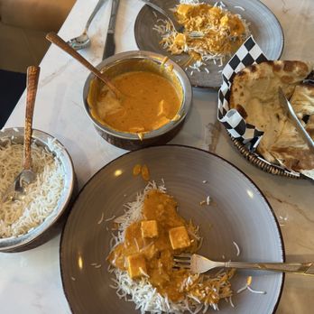 Krsma - Table with Shahi Paneer, Plain Rice and Plain Naan - Indian Near Me - Vancouver, British Columbia Krsma - Table with Shahi Paneer, Plain Rice and Plain Naan - Indian Near Me - Vancouver, British Columbia