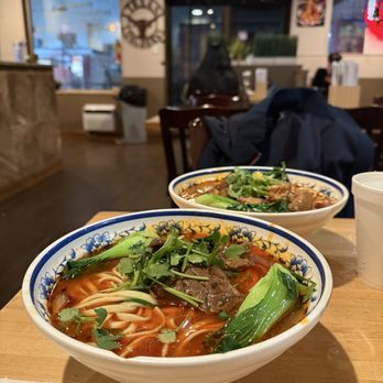 1914 Noodles and More - Braised beef noodle soup (front), Braised pork rib noodle soup (back) - Salad Near Me - Austin, Texas