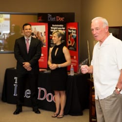 The Diet Doc - Dr. Joe Klemczewski, founder of The Diet Doc, LLC, & Kori Propst, Vice President and Wellness Director, watch as Jerry Sanders speaks.