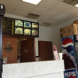 a man standing in front of the counter a man standing in front of the counter