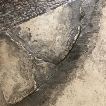 Real Property Management Corazon - Floor title broken in hallway. - Property Management Near Me - Reno, Nevada Real Property Management Corazon - Floor title broken in hallway. - Property Management Near Me - Reno, Nevada