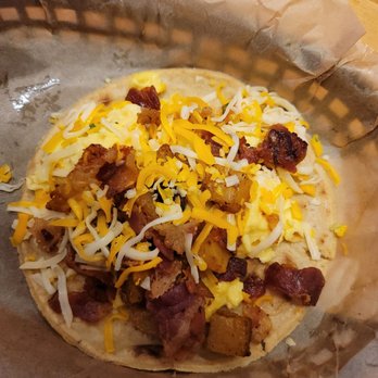 Torchy's Tacos - Bacon egg cheese potato taco on corn - Tacos Near Me - Austin, Texas Torchy's Tacos - Bacon egg cheese potato taco on corn - Tacos Near Me - Austin, Texas