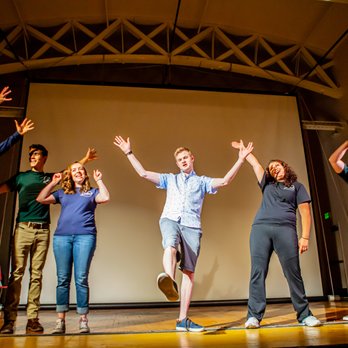 The Antics Comedy Improv - a group of people on stage - Comedy Clubs Near Me - Logan, Utah