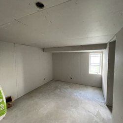 Max Pro Construction - One of our many projects hanging new drywall.