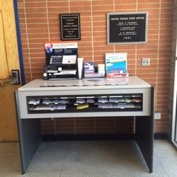 US Post Office - Very organized table with paperwork outside of main room. Nice!