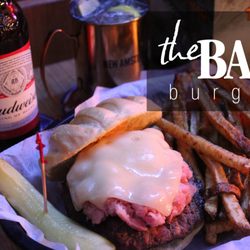 The Bar - Home of "The Bar Burger" Ham and swiss cheese piled on top of a 1/2 pound burger. Don't forget the fresh cut french fries.