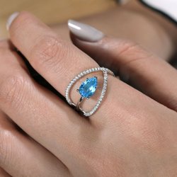Leighton's Fine Diamonds - 14kt white gold blue topaz and diamond ring