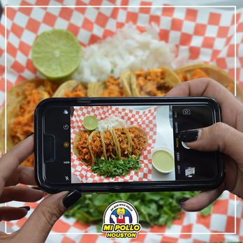 Pollos Asados El Regio - a person taking a picture of food - Mexican Near Me - Houston, Texas Pollos Asados El Regio - a person taking a picture of food - Mexican Near Me - Houston, Texas