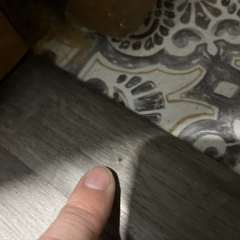 Marc's Flooring Service - Lopsided transition in the doorway; transition has nails sticking up and are sharp - Flooring Near Me - St Peters, Missouri