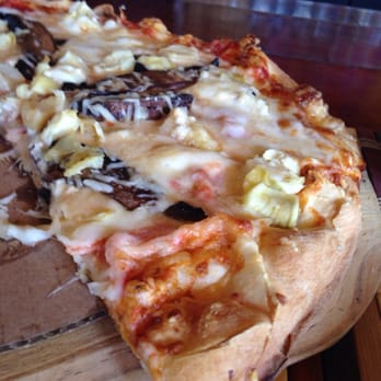 Grind At Kona Tiki Bar - A sample of delicious food: "Imagine" wood fired pizza with mushroom and artichoke. Yum! - New American Near Me - Ormond Beach, Florida Grind At Kona Tiki Bar - A sample of delicious food: "Imagine" wood fired pizza with mushroom and artichoke. Yum! - New American Near Me - Ormond Beach, Florida