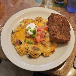 Crossroads Cafe - Mike's Mess (scrambled eggs/potatoes/bacon/mushroom/ jack & cheddar/tomato/sour cream/green onion) with grilled banana bread