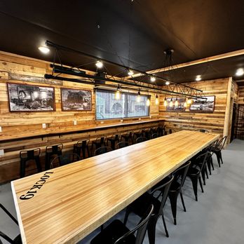Lock 19 - a long wooden table in a restaurant - Burgers Near Me - Nauvoo, Illinois