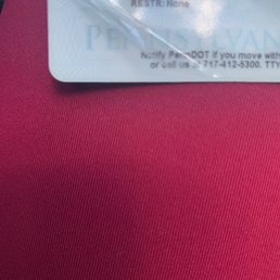 Employee proceed to peel up the corner of my ID that was barely lifting Employee proceed to peel up the corner of my ID that was barely lifting