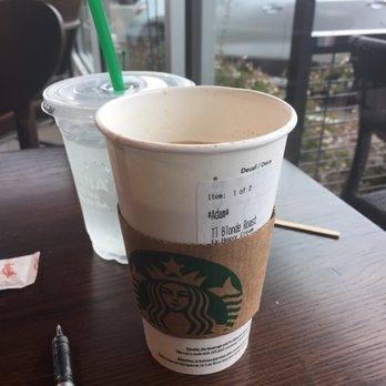 Starbucks - a cup of coffee and a pen on a table - Coffee & Tea Near Me - Mission, British Columbia Starbucks - a cup of coffee and a pen on a table - Coffee & Tea Near Me - Mission, British Columbia