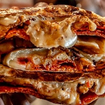 Man vs Fries - a stack of grilled pizzas - Food Delivery Services Near Me - Los Angeles, California Man vs Fries - a stack of grilled pizzas - Food Delivery Services Near Me - Los Angeles, California