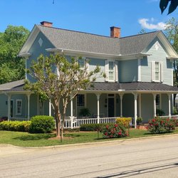 Shield Roofing - Beautiful historic house in downtown Apex with Certainteed Landmark Driftwood shingles and dark bronze standing seam metal.