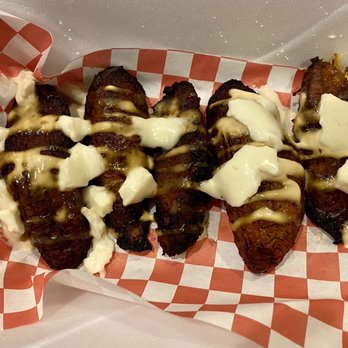 Frida’s Taqueria - Sweet plantains topped with queso and table cream - Mexican Near Me - Lilburn, Georgia Frida’s Taqueria - Sweet plantains topped with queso and table cream - Mexican Near Me - Lilburn, Georgia