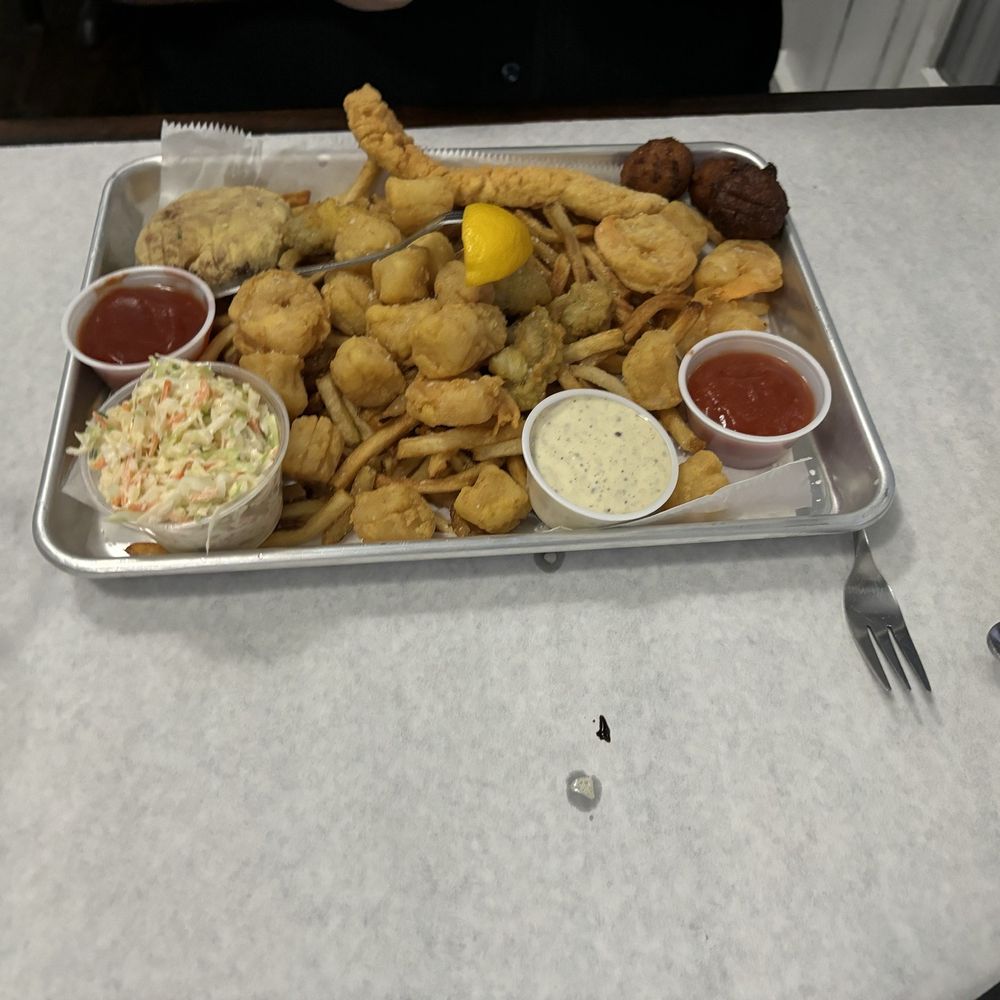 Fried crab legs, scallops, shrimp, fish and hush puppies Fried crab legs, scallops, shrimp, fish and hush puppies
