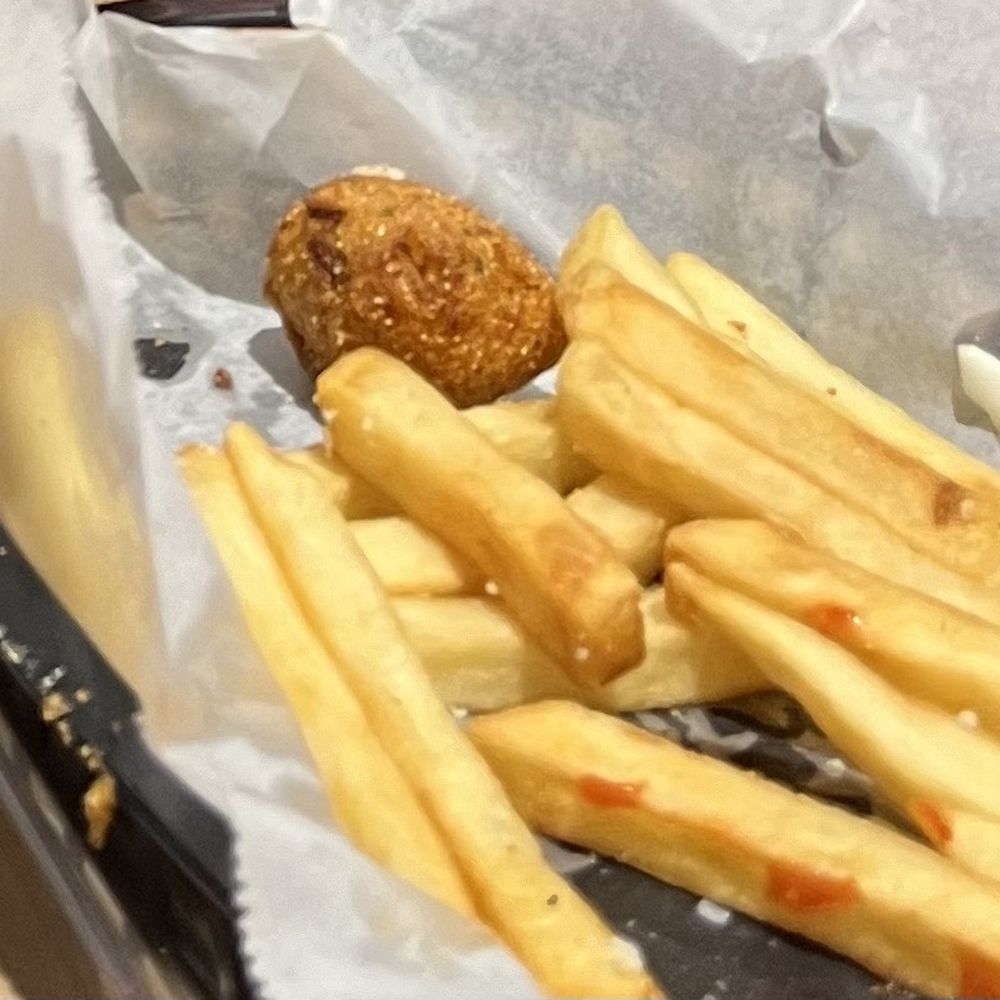 Crispy perfect hush puppies and fries. Crispy perfect hush puppies and fries.
