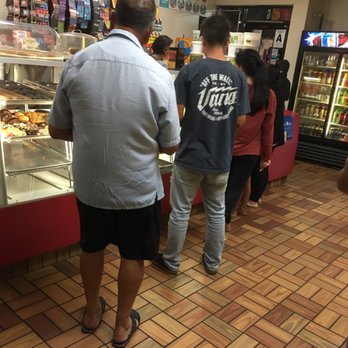 Christy's Donuts - customers waiting in line at the counter - Donuts Near Me - Moreno Valley, California