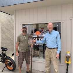 Out Of The Dark - Expertly repaired lamp outside the store (Mark on left).