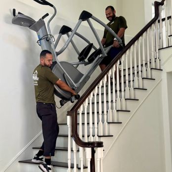 J&G Full Service Moving - Marcos and Eddie navigating the staircase with the heavy elliptical machine. - Movers Near Me - Valencia, California