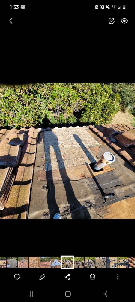 Slide of Courtesy Roofing Services