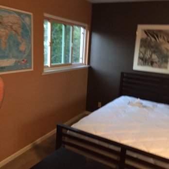 Finish Line Constuction - a bed in a bedroom - General Contractors Near Me