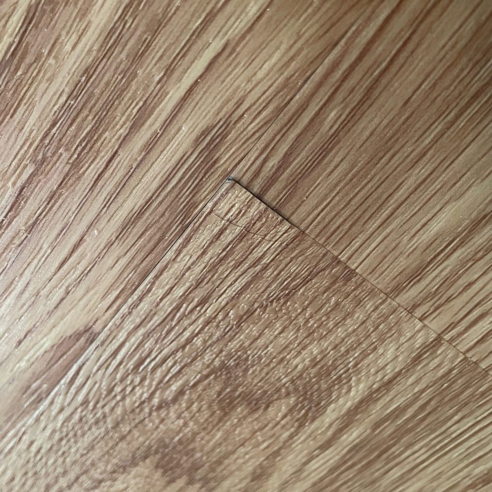 One of the floor boards that is pulling up in another room. One of the floor boards that is pulling up in another room.