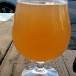 Enjoying a beer out on the picnic table Enjoying a beer out on the picnic table