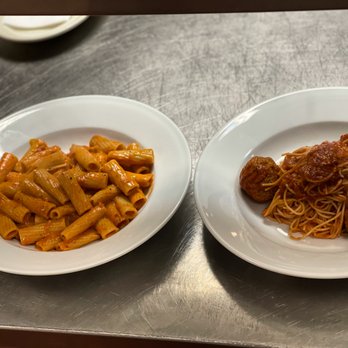 Roma Italian Kitchen & Bar - two plates of pasta and meatballs - Italian Near Me - Tyler, Texas Roma Italian Kitchen & Bar - two plates of pasta and meatballs - Italian Near Me - Tyler, Texas