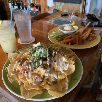 Guanabanas - Buffalo chicken dip over nachos - Seafood Near Me - Jupiter, Florida Guanabanas - Buffalo chicken dip over nachos - Seafood Near Me - Jupiter, Florida